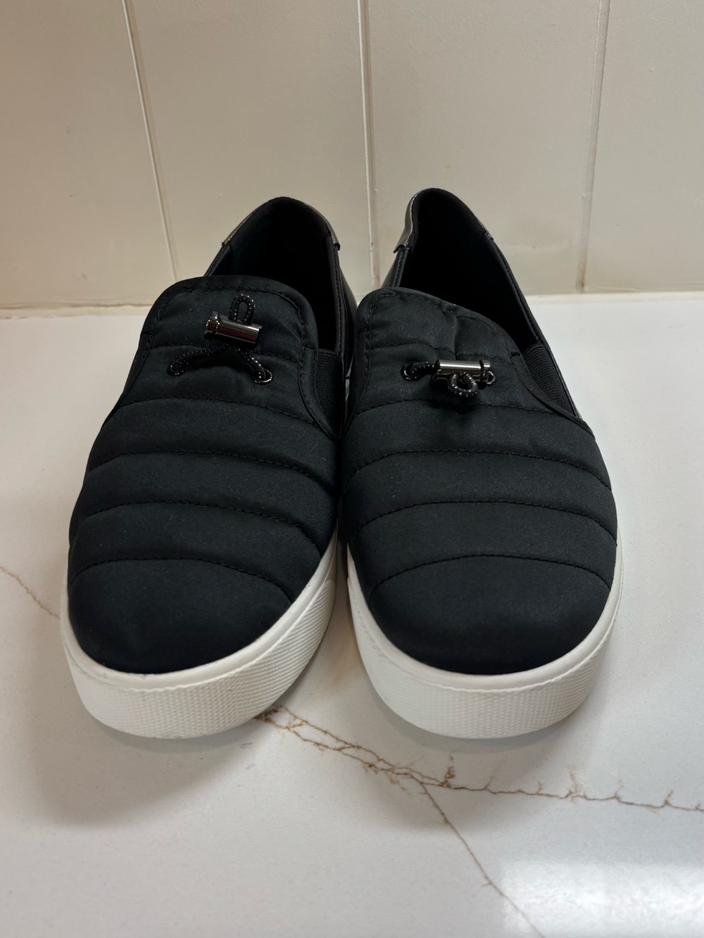 Cole Haan Black Quilted Slip-On Sneakers with White Sole